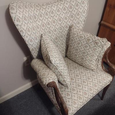 Vintage Wingback Chair with Carved Wood Arms and Legs and Button Tufted Accent