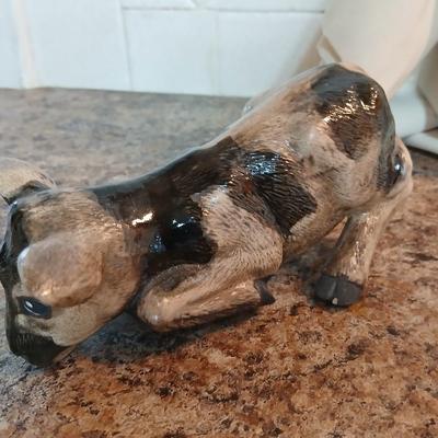 Cow parade Milk Toast with a calf peeking off the shelf