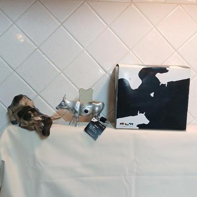 Cow parade Milk Toast with a calf peeking off the shelf