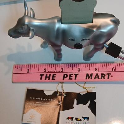 Cow parade Milk Toast with a calf peeking off the shelf