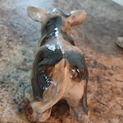 Cow parade Milk Toast with a calf peeking off the shelf