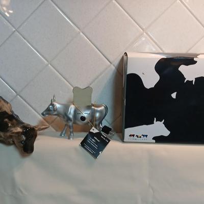 Cow parade Milk Toast with a calf peeking off the shelf