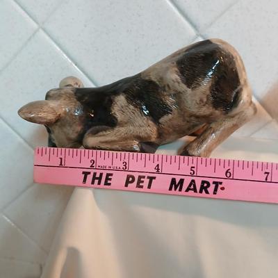 Cow parade Milk Toast with a calf peeking off the shelf