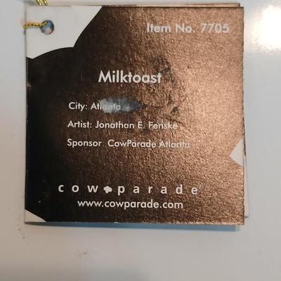 Cow parade Milk Toast with a calf peeking off the shelf