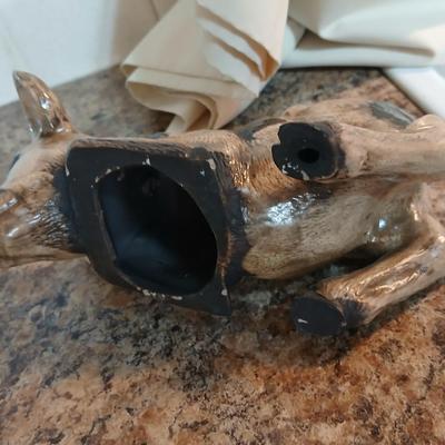 Cow parade Milk Toast with a calf peeking off the shelf