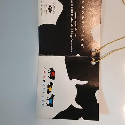 Cow parade Milk Toast with a calf peeking off the shelf