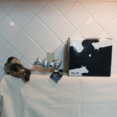 Cow parade Milk Toast with a calf peeking off the shelf