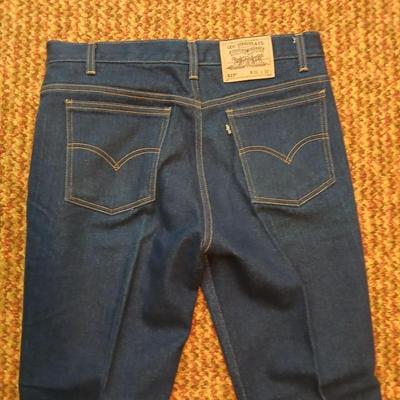 Two pair of like new Brown leather tagged Levi's 517 bootcut jeans in a dark wash with a 36 x 30 size.