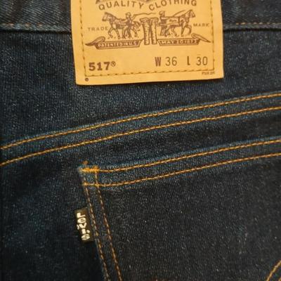 Two pair of like new Brown leather tagged Levi's 517 bootcut jeans in a dark wash with a 36 x 30 size.