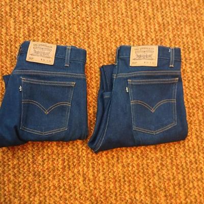 Two pair of like new Brown leather tagged Levi's 517 bootcut jeans in a dark wash with a 36 x 30 size.