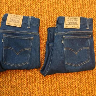 Two pair of like new Brown leather tagged Levi's 517 bootcut jeans in a dark wash with a 36 x 30 size.