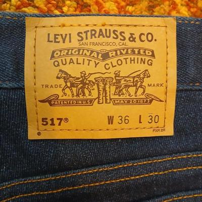 Two pair of like new Brown leather tagged Levi's 517 bootcut jeans in a dark wash with a 36 x 30 size.