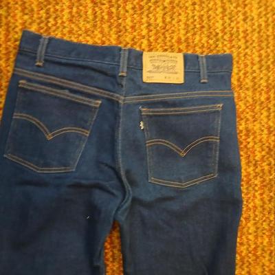 Two pair of like new Brown leather tagged Levi's 517 bootcut jeans in a dark wash with a 36 x 30 size.