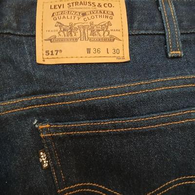 Two pair of like new Brown leather tagged Levi's 517 bootcut jeans in a dark wash with a 36 x 30 size.