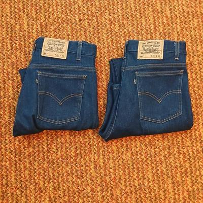 Two pair of like new Brown leather tagged Levi's 517 bootcut jeans in a dark wash with a 36 x 30 size.