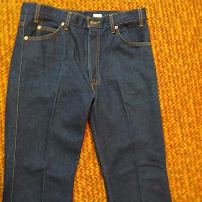 Two pair of like new Brown leather tagged Levi's 517 bootcut jeans in a dark wash with a 36 x 30 size.