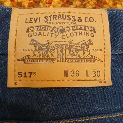 Two pair of like new Brown leather tagged Levi's 517 bootcut jeans in a dark wash with a 36 x 30 size.