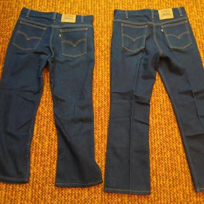 Two pair of like new Brown leather tagged Levi's 517 bootcut jeans in a dark wash with a 36 x 30 size.