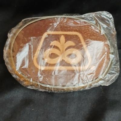 Advertisement buckles = Dekalb advertising belt buckle featuring the "flying corn cob" logo. & a Pioneer Seed Company oval...