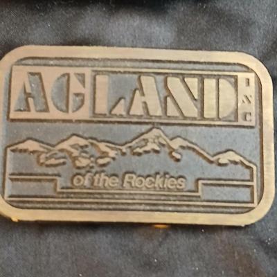 Brass belt buckles - 1976 Bergamot Brass Works "Plow Horse" or "Farmer" belt buckle & a AGLAND of the Rockies buckle