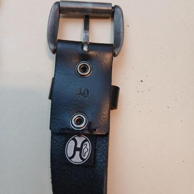 Collection of 4 belts - Black leather and white multi holed
