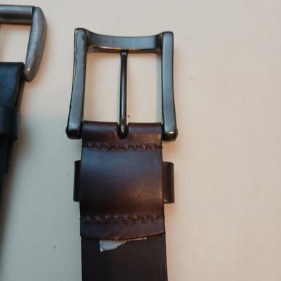 Collection of 4 belts - Black leather and white multi holed