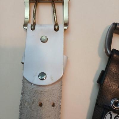 Collection of 4 belts - Black leather and white multi holed