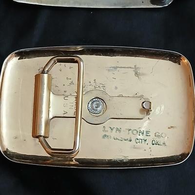 Two horse themed belt buckles -vintage Ricardo nickel silver and bronze western belt buckle & a vintage Lyn Tone Co. horse head buckle