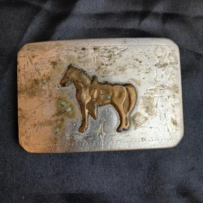 Two horse themed belt buckles -vintage Ricardo nickel silver and bronze western belt buckle & a vintage Lyn Tone Co. horse head buckle