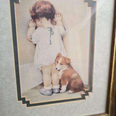 Two framed wall art pieces dog themed =vintage framed print titled "Comrades" by C. Mitchel & A little girl in time out...