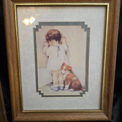 Two framed wall art pieces dog themed =vintage framed print titled "Comrades" by C. Mitchel & A little girl in time out...