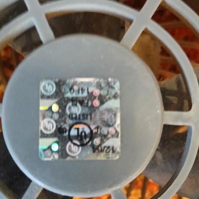 Two fans - Patton chrome free standing and smaller Kaz Inc. DT-70 Series tabletop fan