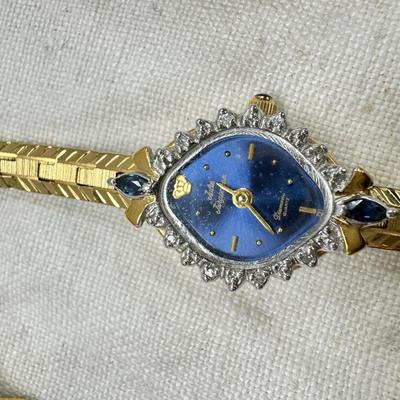 Sale Photo Thumbnail #181: All watches are from one collection, none of them are running assume all need new batteries or maybe other work. 1 Vintage non working pocket watch. Cuff watches, some stones and crystal. Watch bands.