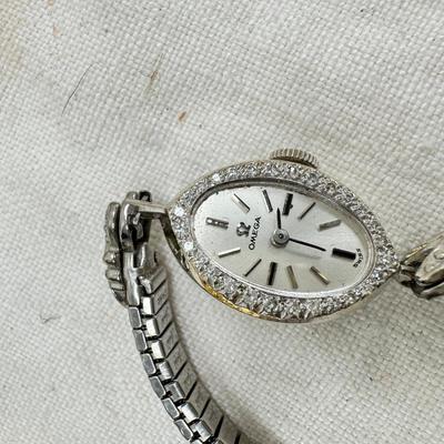 Sale Photo Thumbnail #185: All watches are from one collection, none of them are running assume all need new batteries or maybe other work. 1 Vintage non working pocket watch. Cuff watches, some stones and crystal. Watch bands.