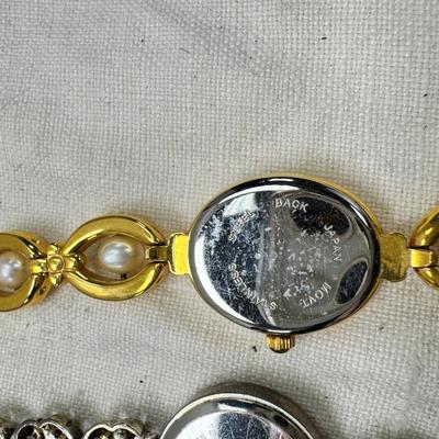 Sale Photo Thumbnail #180: All watches are from one collection, none of them are running assume all need new batteries or maybe other work. 1 Vintage non working pocket watch. Cuff watches, some stones and crystal. Watch bands.