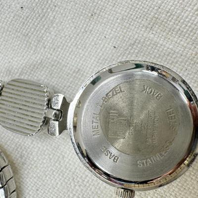 Sale Photo Thumbnail #184: All watches are from one collection, none of them are running assume all need new batteries or maybe other work. 1 Vintage non working pocket watch. Cuff watches, some stones and crystal. Watch bands.