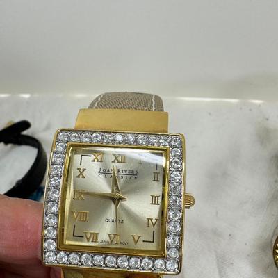 Sale Photo Thumbnail #172: All watches are from one collection, none of them are running assume all need new batteries or maybe other work. 1 Vintage non working pocket watch. Cuff watches, some stones and crystal. Watch bands.