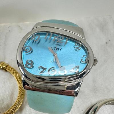 Sale Photo Thumbnail #168: All watches are from one collection, none of them are running assume all need new batteries or maybe other work. 1 Vintage non working pocket watch. Cuff watches, some stones and crystal. Watch bands.