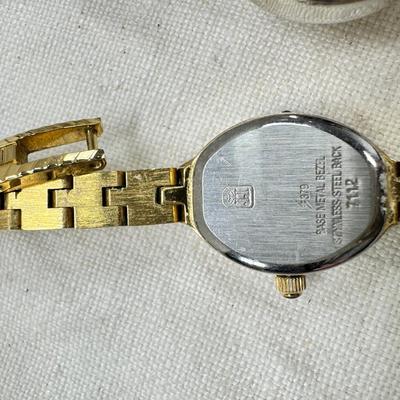 Sale Photo Thumbnail #182: All watches are from one collection, none of them are running assume all need new batteries or maybe other work. 1 Vintage non working pocket watch. Cuff watches, some stones and crystal. Watch bands.