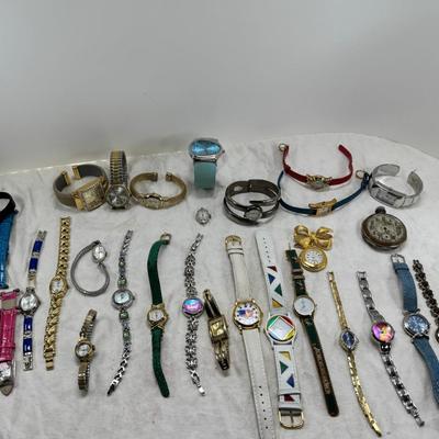 Sale Photo Thumbnail #166: All watches are from one collection, none of them are running assume all need new batteries or maybe other work. 1 Vintage non working pocket watch. Cuff watches, some stones and crystal. Watch bands.