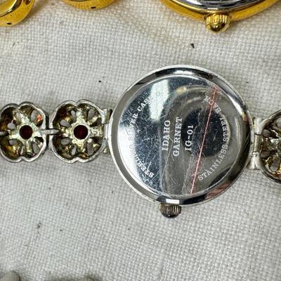 Sale Photo Thumbnail #179: All watches are from one collection, none of them are running assume all need new batteries or maybe other work. 1 Vintage non working pocket watch. Cuff watches, some stones and crystal. Watch bands.