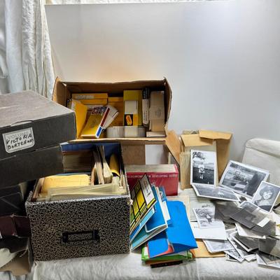 Sale Photo Thumbnail #186: Slides in trays, negatives, Black and white 1940s photos, Color prints 1960s Boxes of slides. If you like a mystery these slides and photos will be a fun project. There are also a lot of empty celluloid envelopes .