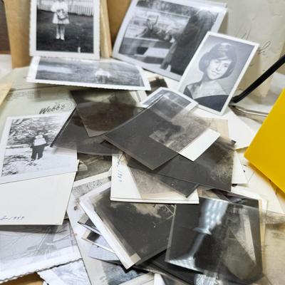 Sale Photo Thumbnail #187: Slides in trays, negatives, Black and white 1940s photos, Color prints 1960s Boxes of slides. If you like a mystery these slides and photos will be a fun project. There are also a lot of empty celluloid envelopes .
