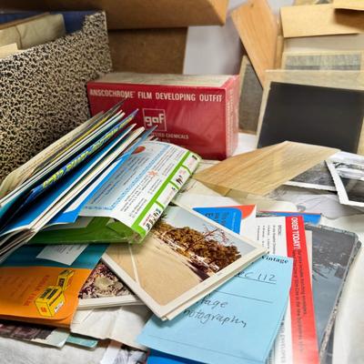 Sale Photo Thumbnail #197: Slides in trays, negatives, Black and white 1940s photos, Color prints 1960s Boxes of slides. If you like a mystery these slides and photos will be a fun project. There are also a lot of empty celluloid envelopes .