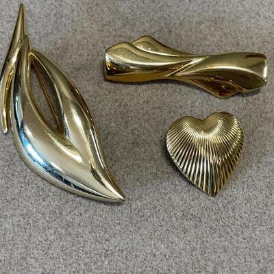 3 gold tone brooches