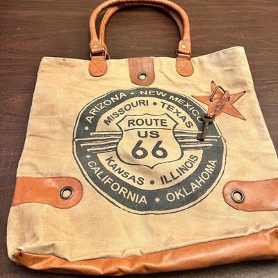 Sale Photo Thumbnail #154: Heavy canvas body with faux-leather trim and handles. Western/Americana vibe with star patch and metal hardware.

These are usually modern retro-themed tourist or boutique bags (often found in Route 66 gift shops, Cracker Barrel, small boutiques, etc.).

