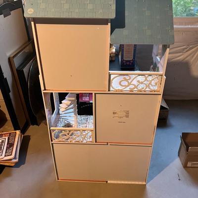 Sale Photo Thumbnail #157: Large KidKraft wooden dollhouse, model 114803 / 65891, manufactured in 2015. This is a sturdy, multi-level dollhouse featuring:

Three full stories

Spiral staircase

Balcony with decorative railing

Multiple furnished printed room designs

Light blue shi