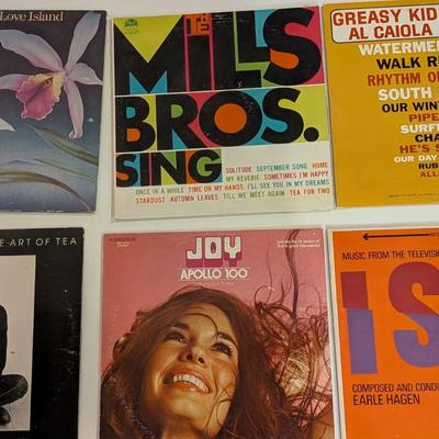 Sale Photo Thumbnail #175: A vibrant and varied mix of mid-century and 1970s/80s vinyl, perfect for crate-diggers, decorators, and collectors of unique cover art. This lot features jazz fusion, classic vocal harmony, orchestral pop, and iconic television soundtrack music.

Includes