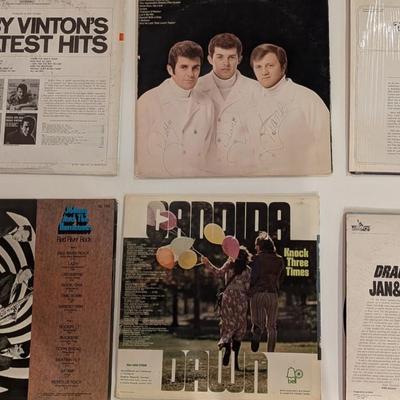 Sale Photo Thumbnail #176: Nice mixed lot of 1960s–1970s pop, vocal harmony, surf rock, and oldies LPs. Includes several sealed or partially sealed jackets, plus a signed Lettermen LP (facsimile signatures common—priced accordingly). Jackets show varying degrees of shelf wear; 