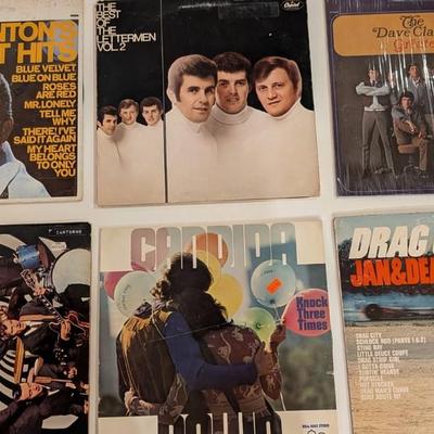Sale Photo Thumbnail #177: Nice mixed lot of 1960s–1970s pop, vocal harmony, surf rock, and oldies LPs. Includes several sealed or partially sealed jackets, plus a signed Lettermen LP (facsimile signatures common—priced accordingly). Jackets show varying degrees of shelf wear; 